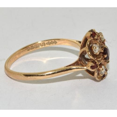 267 - 9ct Gold Antique Garnet Daisy Cluster Ring in an open work claw setting   Fully hallmarked... 