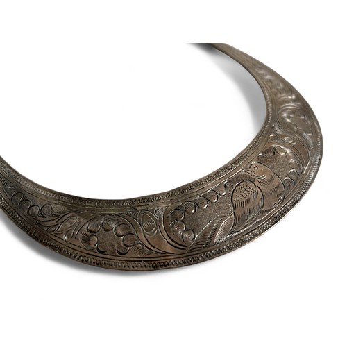 442 - Two Thai Silvered neck ring (torque).Engraved with birds and flora.