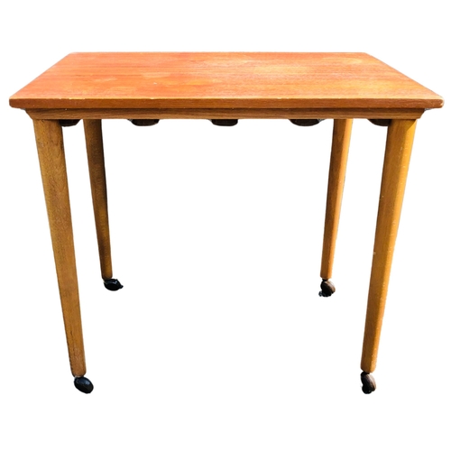 7 - Small  Mid Century Table on original casters. Made in Czechoslovakia. Beech construction with a teak... 