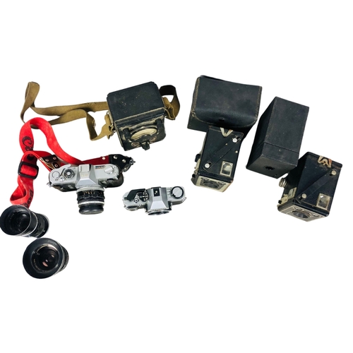 39 - Assortment of Vintage Cameras and lenses to include Cannon and Olympus Etc.