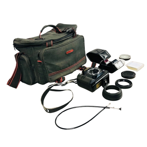 41 - Vintage camera equipment and bag to include Cannon T90 Camera and flash units