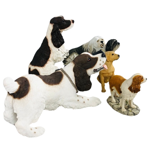 99 - Collection of dog figurines ceramic and resin