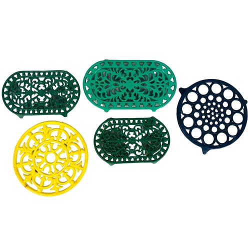 108 - Collection of cast iron trivets