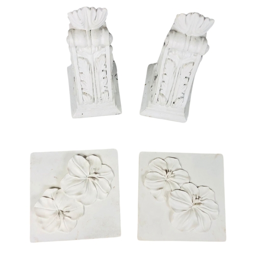 138 - Pair of plaster corbels and 2 resin wall hangings.