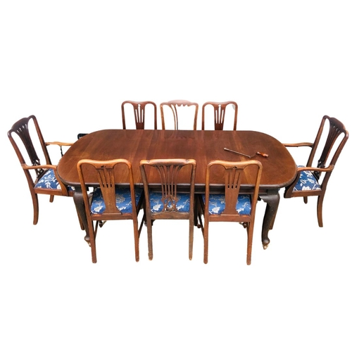 361 - A mahogany wind out dining table with one leaf insert. Complete with winder. Six Chairs and Two Carv... 