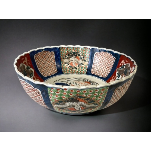 307A - A Large 19th Century Japanese Arita Imari Porcelain Fruit Bowl. Meiji Period. Painted panels depicti... 