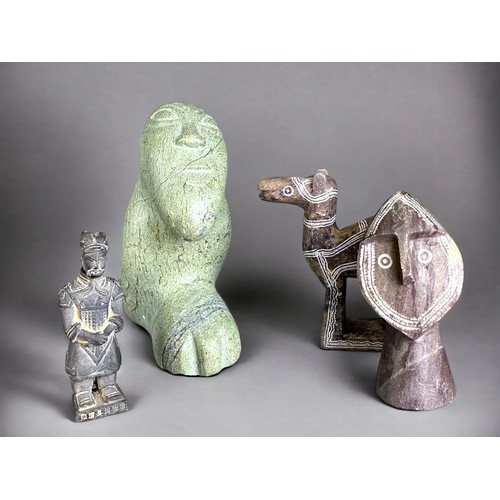 234 - A collection of stone sculptures. To include an Inuit sculpture, 20th century. Marked to base. Two S... 