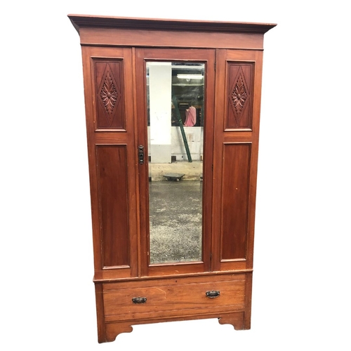 261 - Wardrobe with central bevelled dressing mirror and drawer beneath. Approx 203cms x 117 x 50