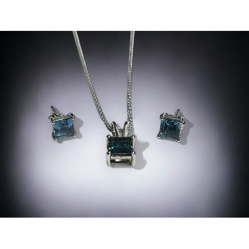 360 - A Silver & blue Topaz pendant necklace and earrings set.Total of 5.14cts.