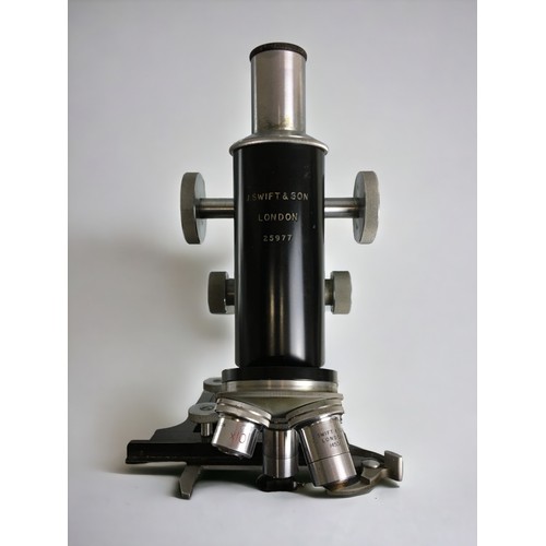 381 - A mid-20th century black enamelled monocular microscope, signed 'J. Swift & Son London' and numb... 