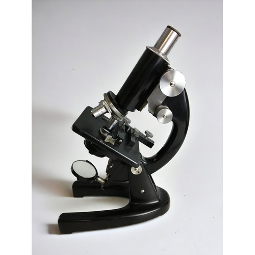 381 - A mid-20th century black enamelled monocular microscope, signed 'J. Swift & Son London' and numb... 