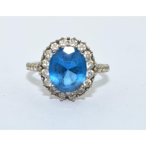 212 - 925 silver large marine colour blue centre stone in a halo design size U