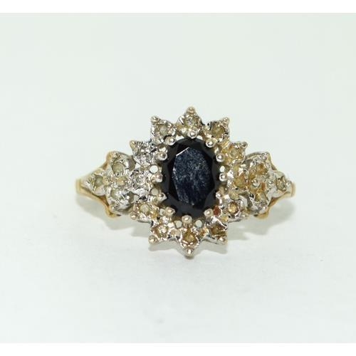 228 - 9ct gold ladies Diamond and Sapphire cluster ring Hall marked in ring as diamond size P