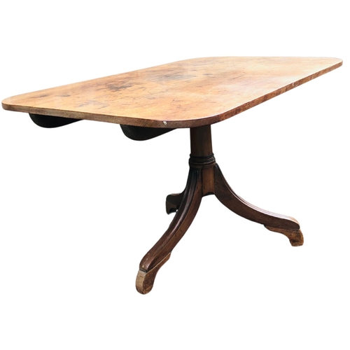 6 - Mahogany tilt top action breakfast table on tripod leg base terminating in brass casters