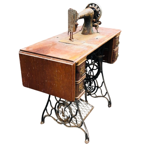 9 - Treadle Singer Sewing Machine on original table and legs. width 91cm x 98cm  high