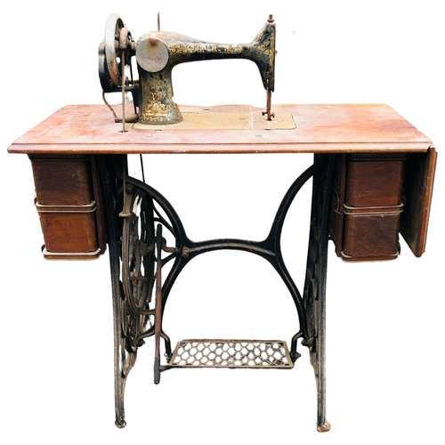 9 - Treadle Singer Sewing Machine on original table and legs. width 91cm x 98cm  high