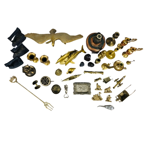 64 - Assortment of brass and copper items to include a toasting fork, candlesticks etc and two antique fl... 