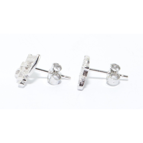 242 - A pair of silver Dior style earrings 