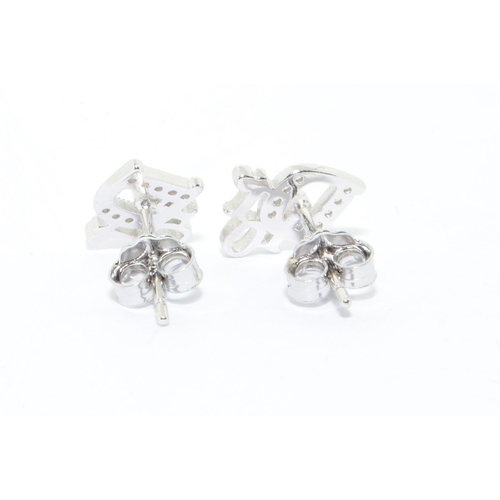 242 - A pair of silver Dior style earrings 