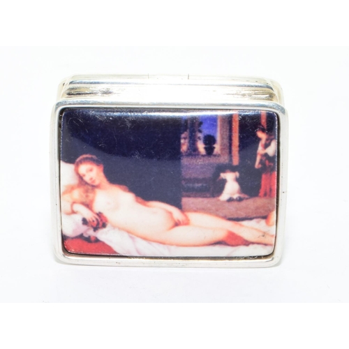 248 - A stamped sterling, silver pill box with a nude enamel panel to the lid