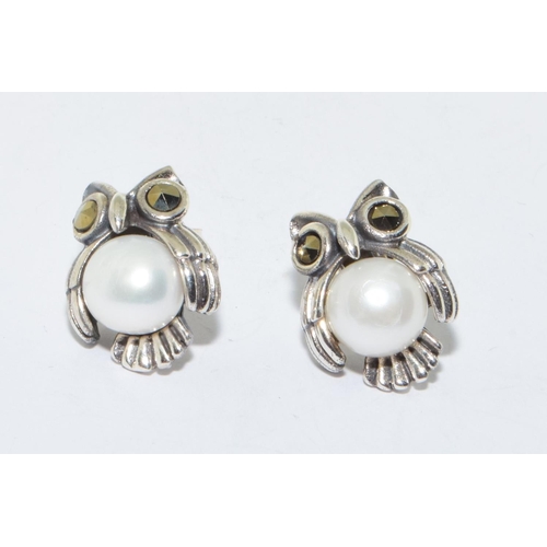 250 - A pair of silver marcasite and pearl owl shape earrings 