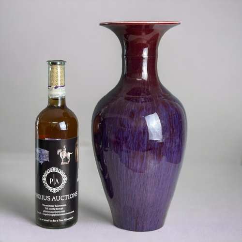 91 - A Chinese Flambe' glazed vase.20th Century, Baluster form.Ox-blood running to purple & lavender.... 