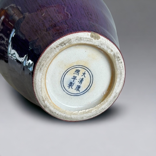 91 - A Chinese Flambe' glazed vase.20th Century, Baluster form.Ox-blood running to purple & lavender.... 