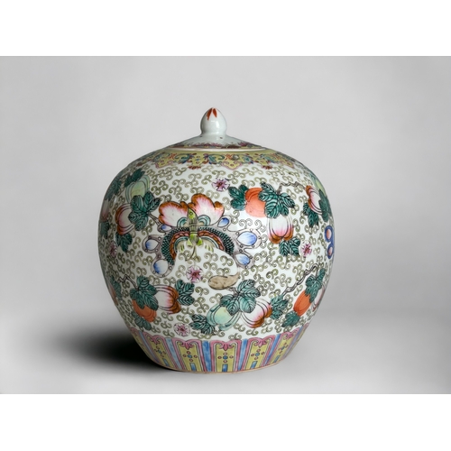 64 - A Chinese Famille Rose porcelain lidded jar.20th Century.Hand painted with numerous fruits & But... 