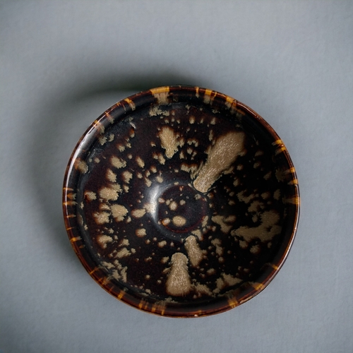 66 - A Chinese Jizhou type glazed bowl.'Tortoiseshell' design.