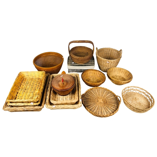 108 - Collection of Wicker Baskets and Trays to include a covered basket in the form of a sitting hen.