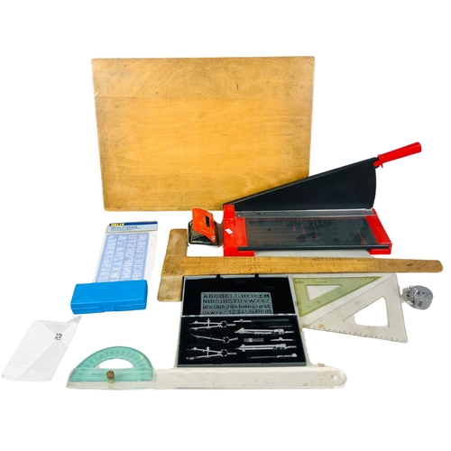 111 - Collection of items to include paper guillotine, stencils etc.