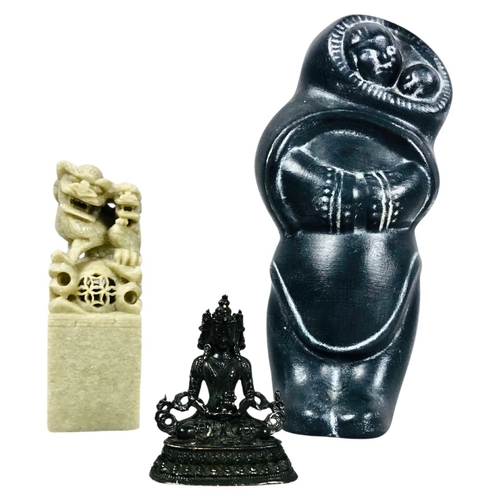 195 - Carved Chinese soapstone seal, together with a bronze buddha and Inuit style carving.