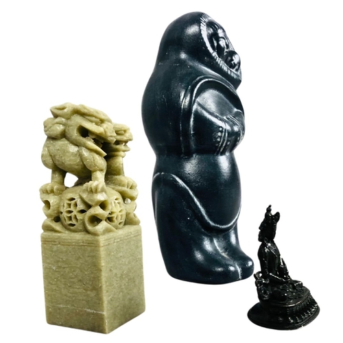 195 - Carved Chinese soapstone seal, together with a bronze buddha and Inuit style carving.