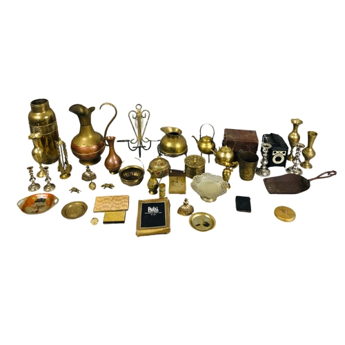 57 - Assortment of brass items and a camera