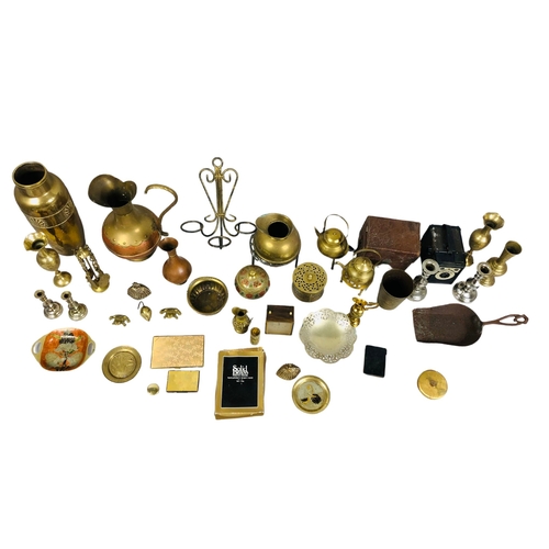 57 - Assortment of brass items and a camera