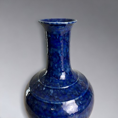 69 - A Chinese porcelain Snowflake blue glaze vase. On a pale celadon ground. 24.5cm Tall.