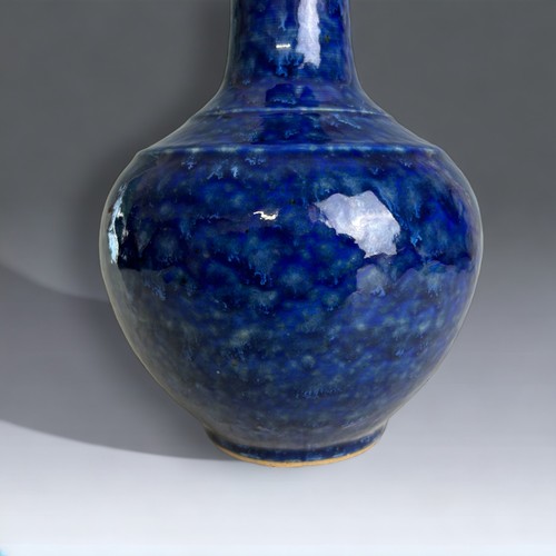 69 - A Chinese porcelain Snowflake blue glaze vase. On a pale celadon ground. 24.5cm Tall.