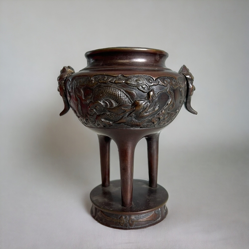 59 - A pair of Japanese bronze Koro / vases.Meiji period.Tripod form on raised base. Onde side decorated ... 