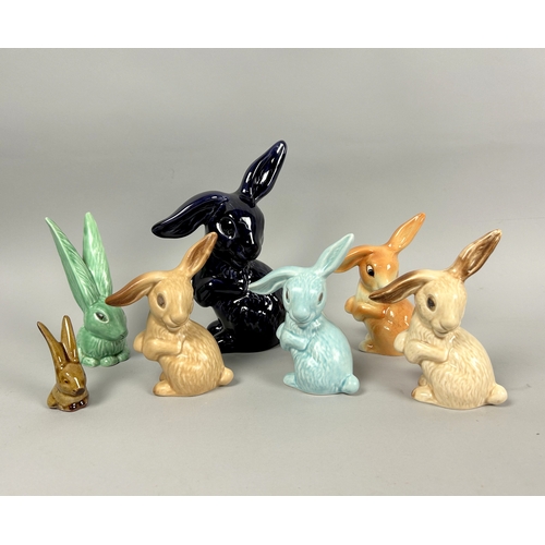 141 - A collection of seven Sylvac pottery bunny figures.