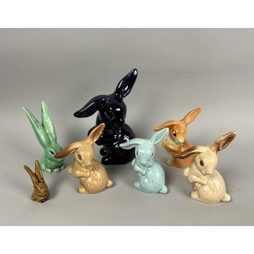 141 - A collection of seven Sylvac pottery bunny figures.