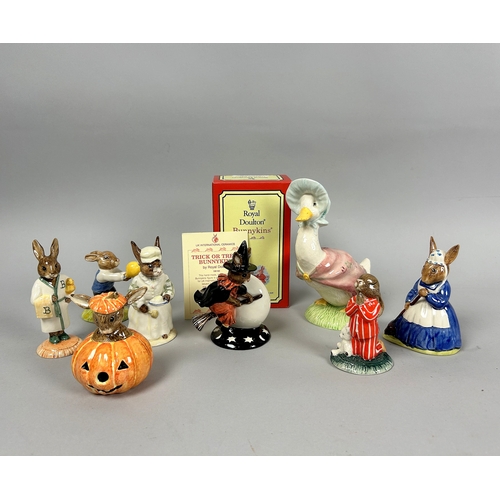 143 - A collection of eight Royal Doulton Bunnykins figurines. Including a boxed 'Trick or Treat' figurine... 