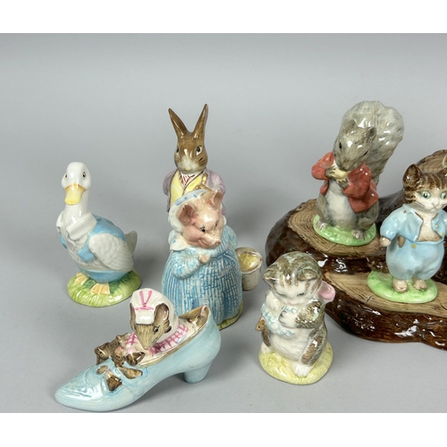 146 - A collection of fifteen Beswick 'Beatrix Potter' figures. Including display stand.