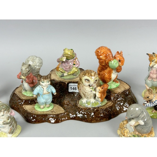 146 - A collection of fifteen Beswick 'Beatrix Potter' figures. Including display stand.