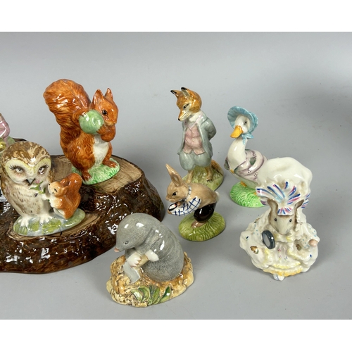 146 - A collection of fifteen Beswick 'Beatrix Potter' figures. Including display stand.