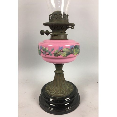 449 - Victorian Oil Lamp, Pink Opaline Glass Reservoir with Foliate Decoration Upon a Black Ceramic Base. ... 