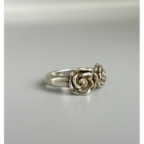 210 - 925 silver designer ring with a design of two flowers  size Q