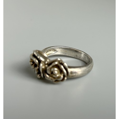 210 - 925 silver designer ring with a design of two flowers  size Q