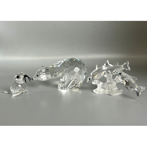 119 - A set of three boxed Swarovski crystal animals. Including Seal, Bear & Trout.