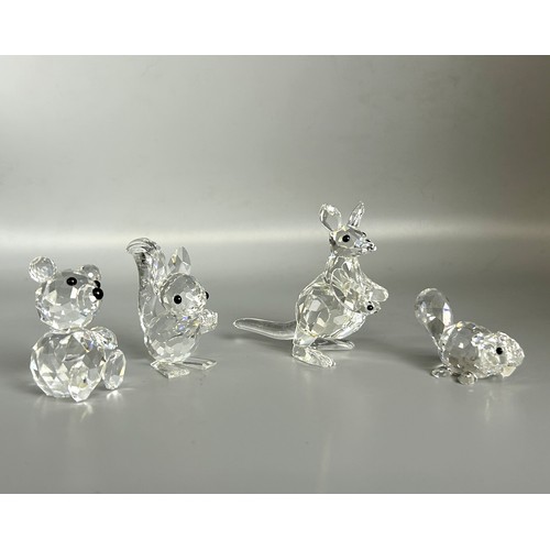 121 - Four boxed Swarovski silver crystal animals. Including Teddy bear, Kangaroo, Squirrel and Beaver.