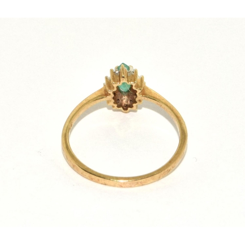 295 - 9ct gold ladies diamond and emerald cluster ring size N